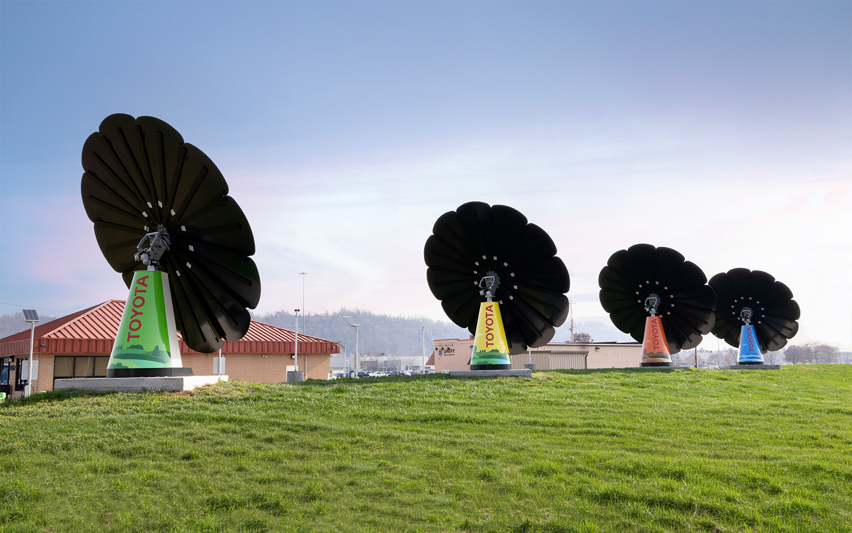 Multiple SmartFlower units on Toyota West Virgina campus, sitting on a manicured green hill