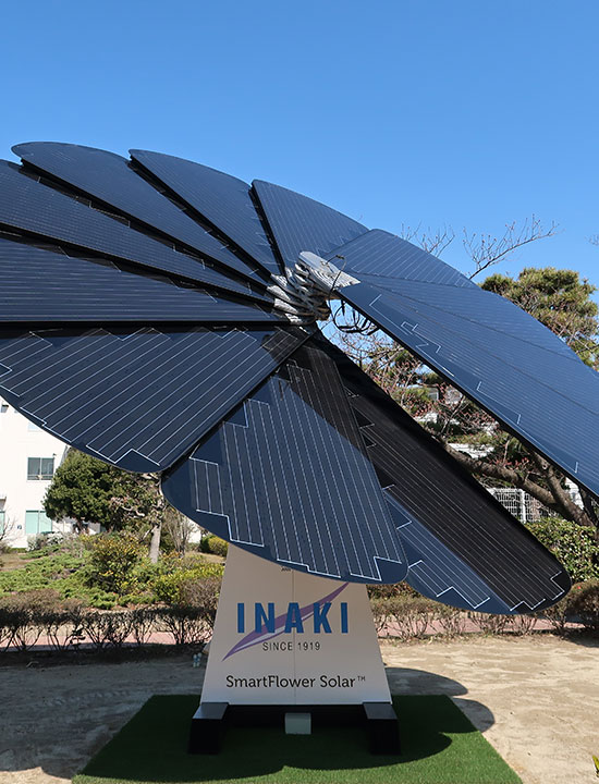 Flower-inspired solar energy unit generating clean power outside modern INAKI company grounds