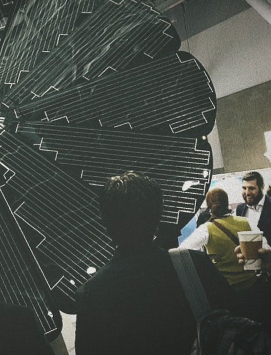 A woman inspecting a smart solar panel unit